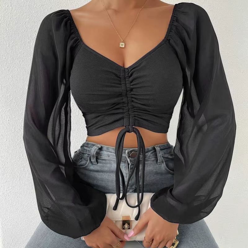Blusa corta con cinturón