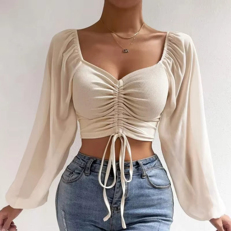 Blusa corta con cinturón
