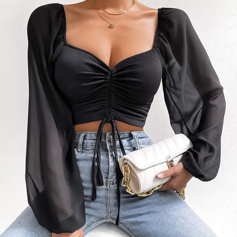 Blusa corta con cinturón