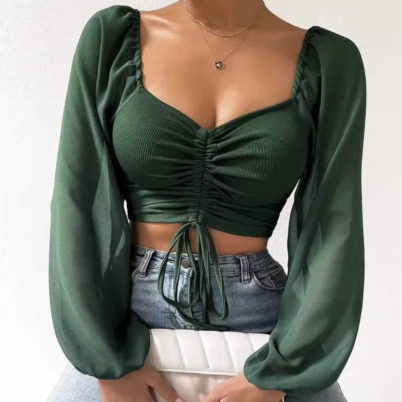Blusa corta con cinturón