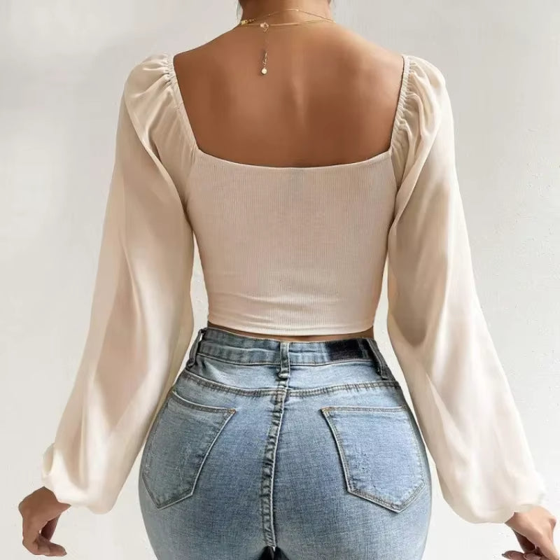 Blusa corta con cinturón